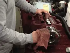 Vacuum repair technician cleaning and servicing a vacuum motor in Green Bay, WI